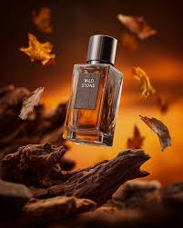 Wild Stone fragrance advertisement with driftwood and autumn leaves